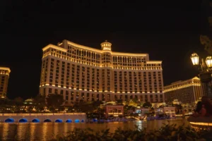 Luxury hotel and casino resort illuminated at night, illustrating cannabis and smoking guidelines for resort guests.